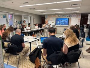 Teachers sitting in a classroom together