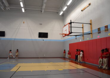 School gym with kids playing