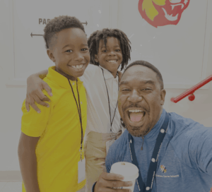 Teacher smiling with students